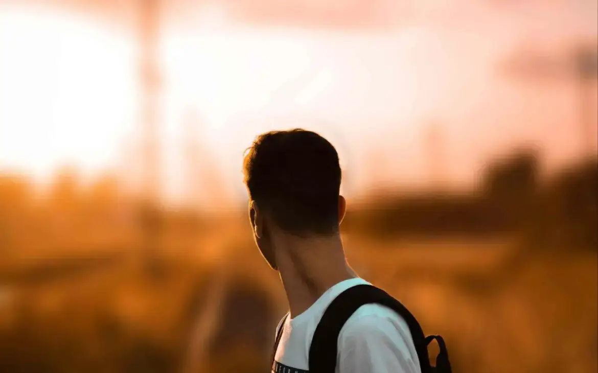 A man walking on a road, looking back, symbolizing the journey of Going Through the Worst Time: From Egypt to Wilderness, showing how tough times lead to growth, clarity, and stronger faith.